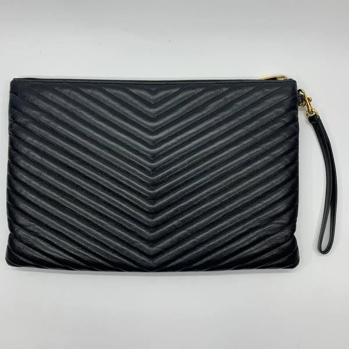 SAINT LAURENT Monogram Matelassé Strap Clutch Bag in Black